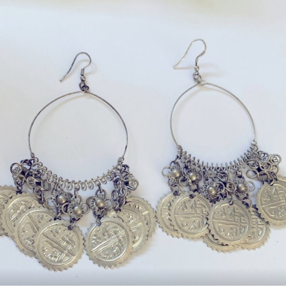 💐Seven dangling faux coin pieces on each circle pierced earring